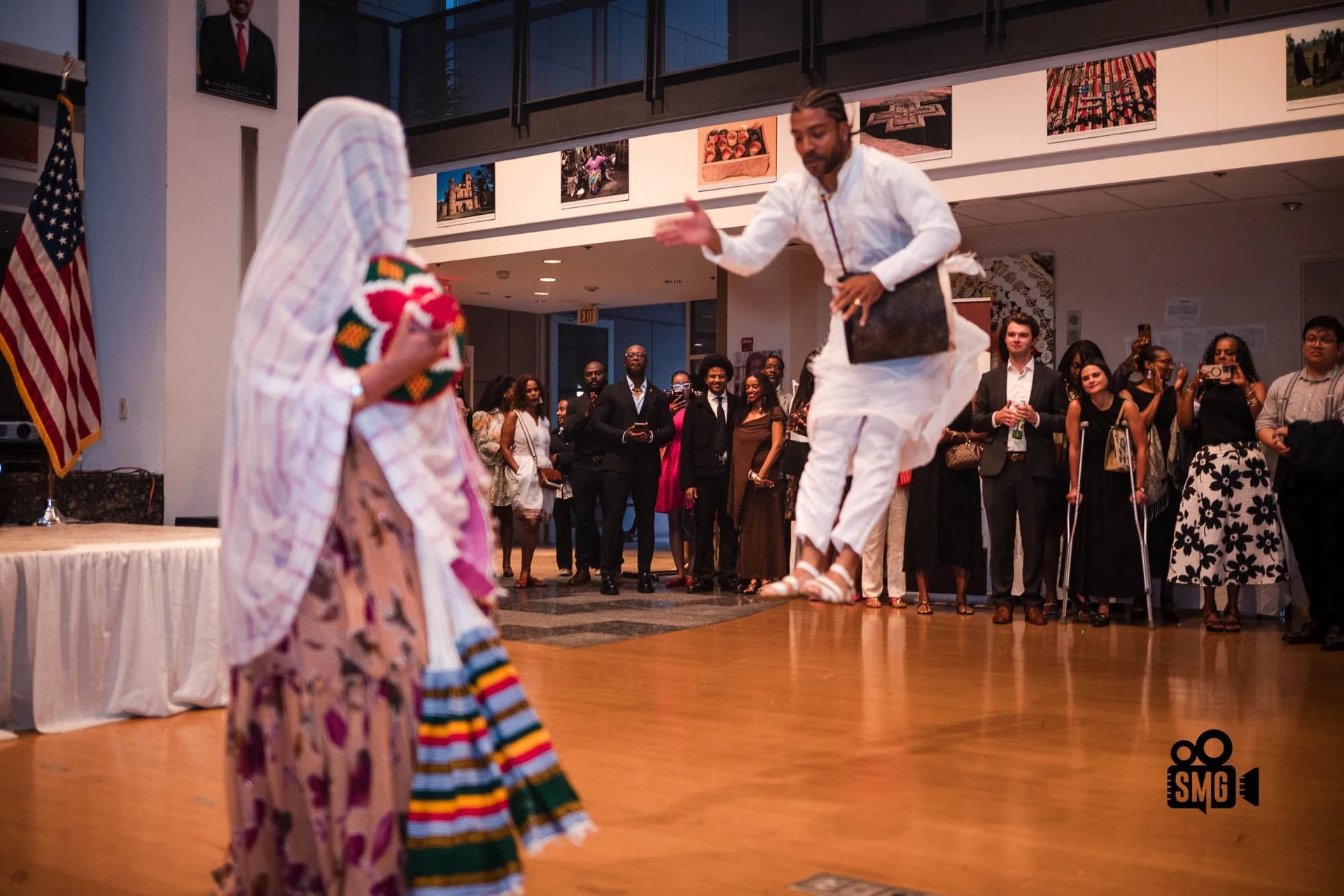 Ethiopian dancers in traditional clothing performing at a cultural celebration