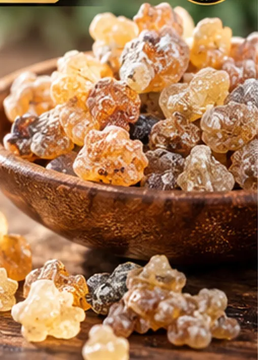 Golden and amber-colored aromatic resin pieces in a wooden bowl, illustrating one kind of incense used in Ethiopian traditions